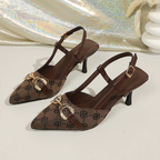 Zapatos de tacón destalonados con punta afilada y cadena metálica para mujer.
