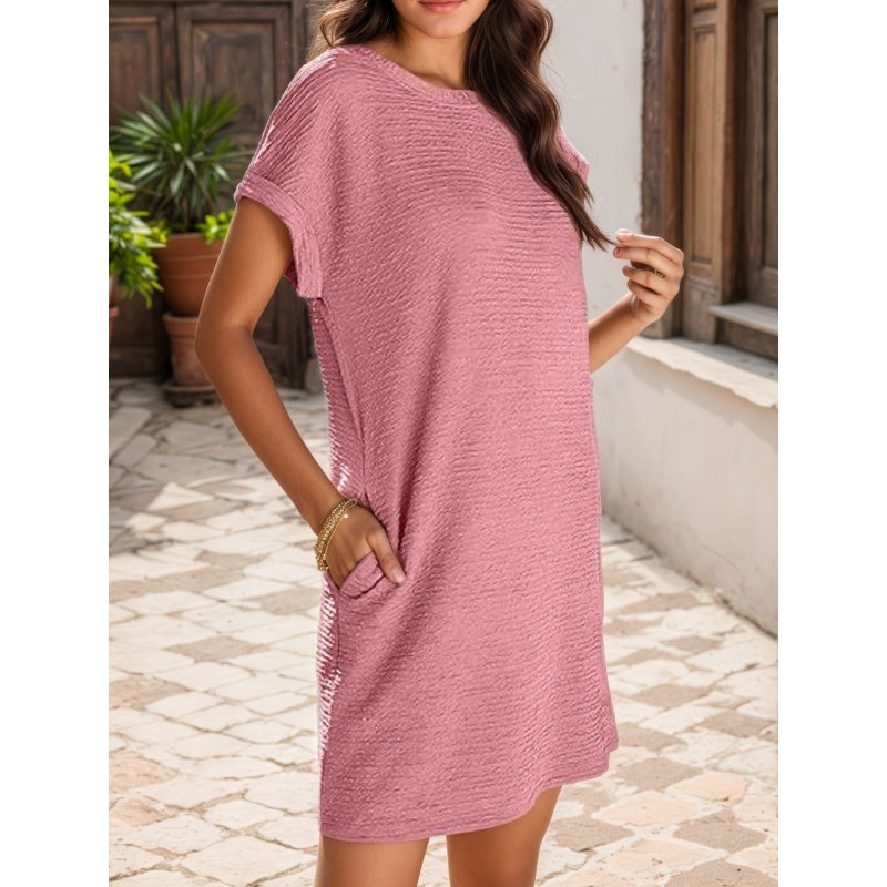 Vestido casual de mujer con mangas enrollables y bolsillos.