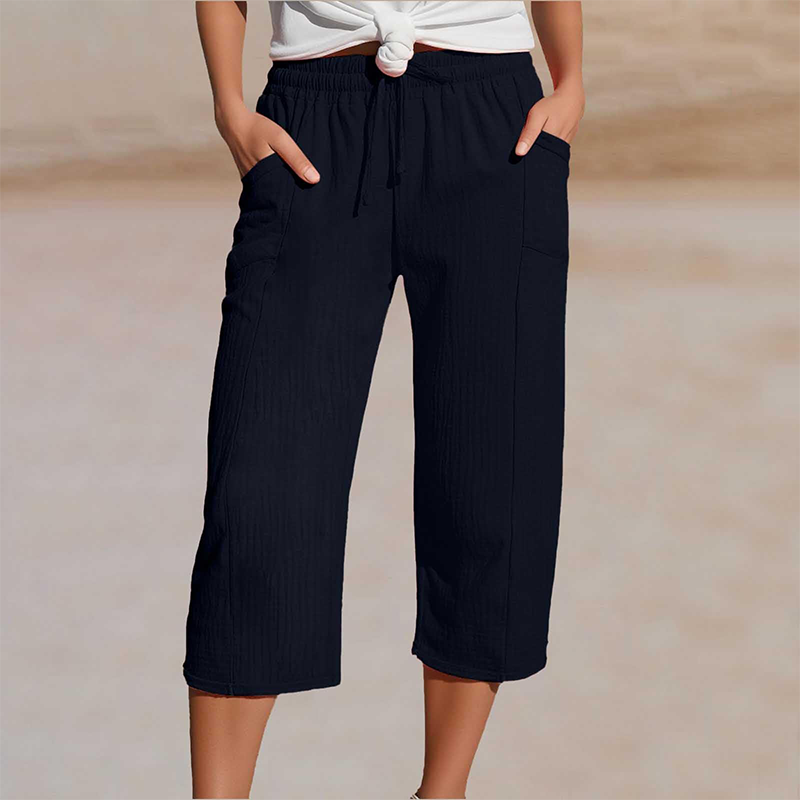 Pantalones cortos plisados de algodón y lino de color liso para mujer
